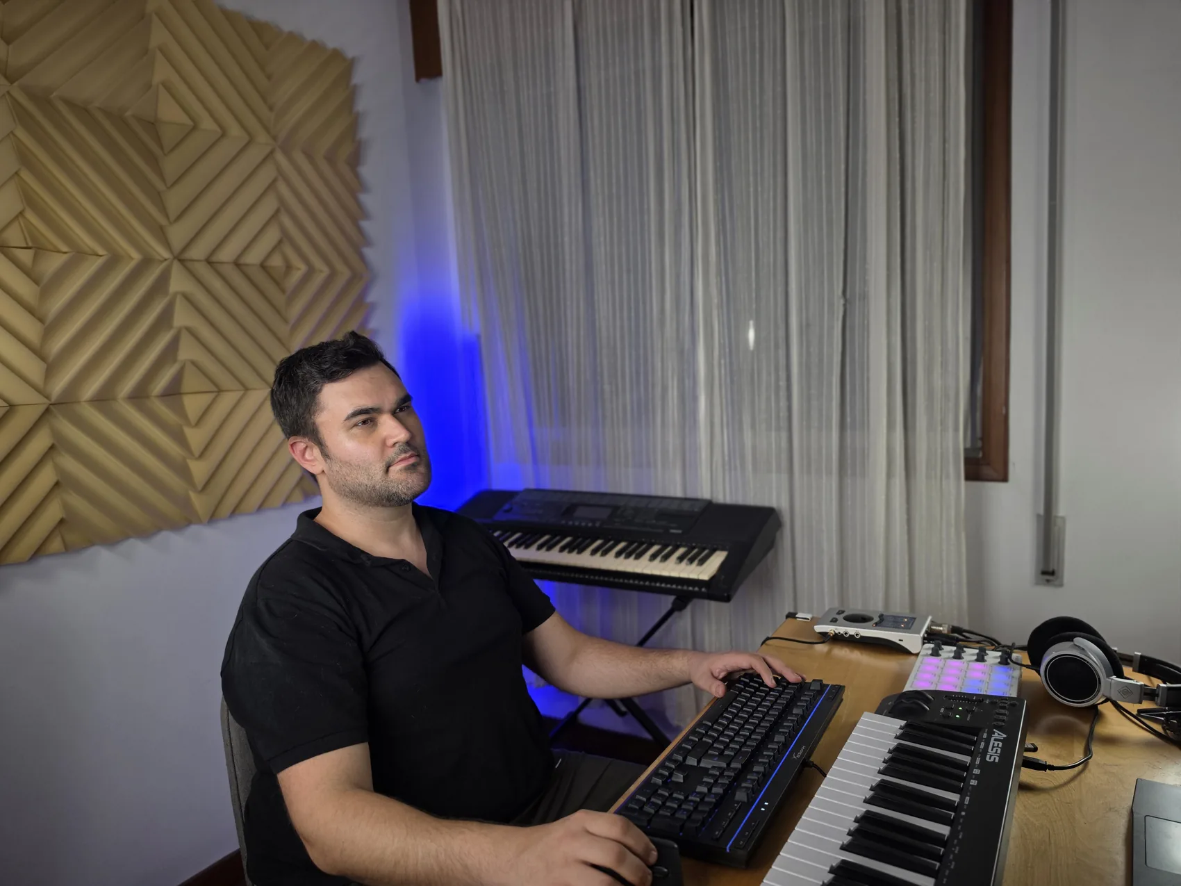 IWARO at his real production desk with keyboard and studio equipment